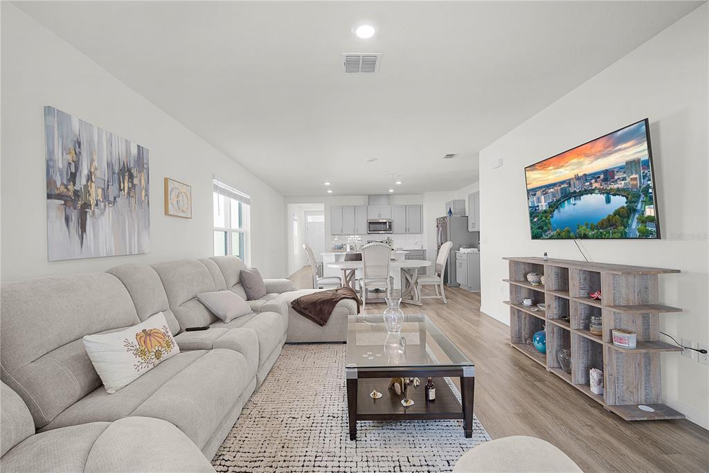 1606 Bull Hl Road Kissimmee, FL 34744 - Photo 27 of 38 a living room with furniture and a flat screen tv
