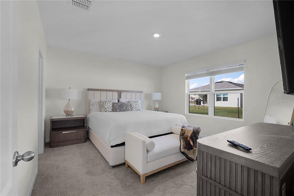 1606 Bull Hl Road Kissimmee, FL 34744 - Photo 28 of 38 a bedroom with a bed and a window