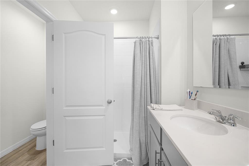 1606 Bull Hl Road Kissimmee, FL 34744 - Photo 31 of 38 a bathroom with a sink a toilet and shower