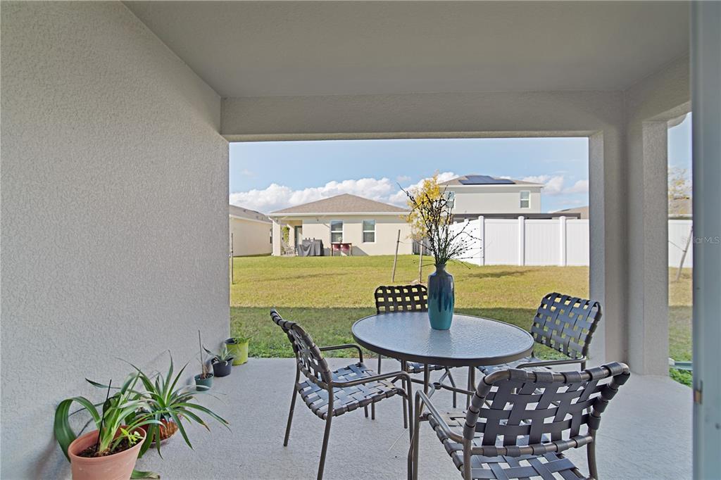 1606 Bull Hl Road Kissimmee, FL 34744 - Photo 34 of 38 a view of a dining room with furniture window and wooden floor