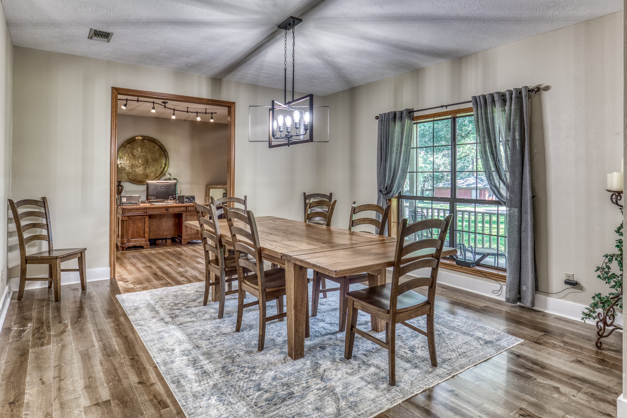 1017 Allen Road Cat Spring, TX 78933 - Photo 10 of 47 a view of a dining room with furniture window and wooden floor