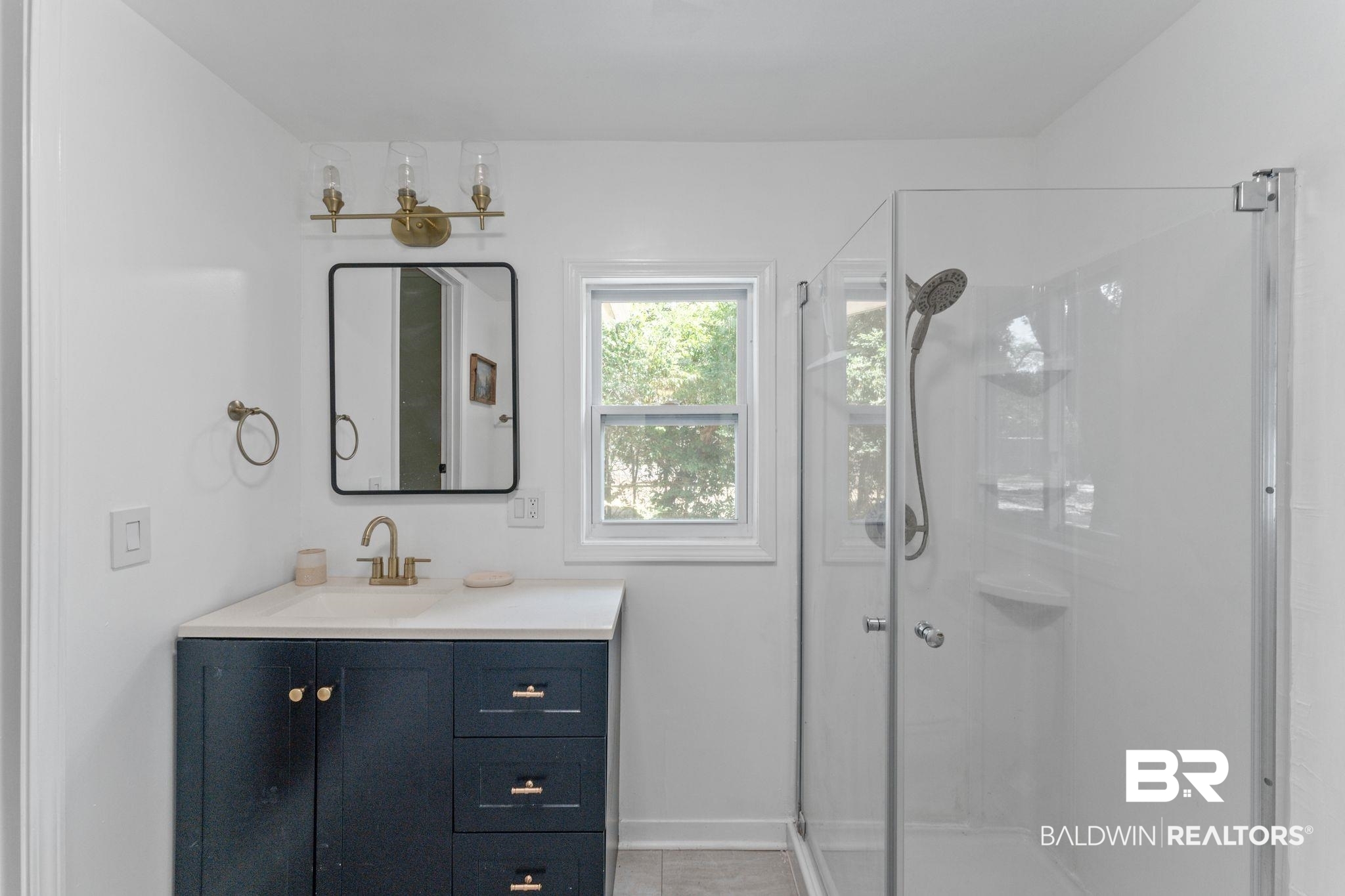 10785 Gregg Road Semmes, AL 36575 - Photo 16 of 35 Full bathroom featuring a shower stall, vanity, and light tile patterned floors