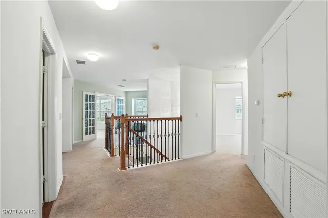a view of a hallway with closet area