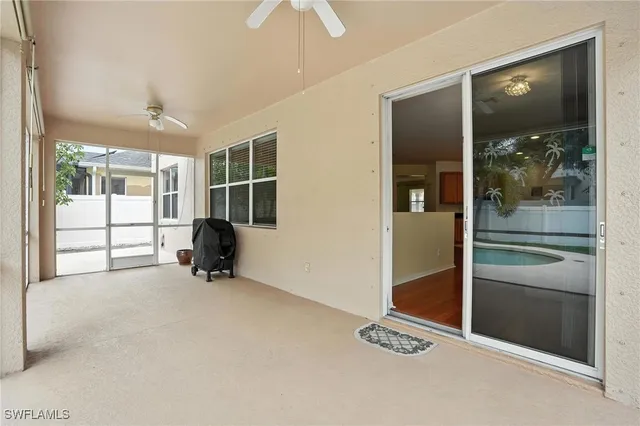 a view of a backyard with swimming pool
