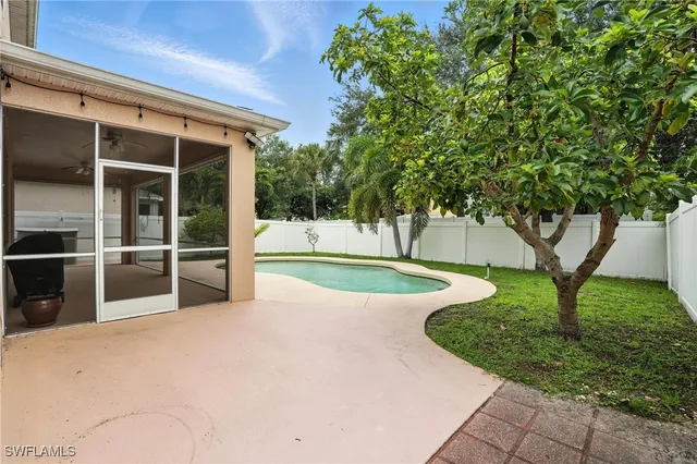 a view of a swimming pool with a yard