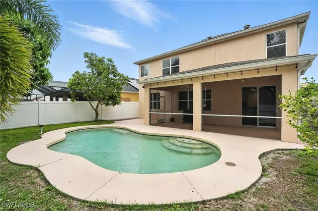 a view of an house with backyard space and garden