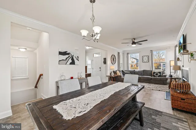 a bedroom with a bed and a potted plant next to a window