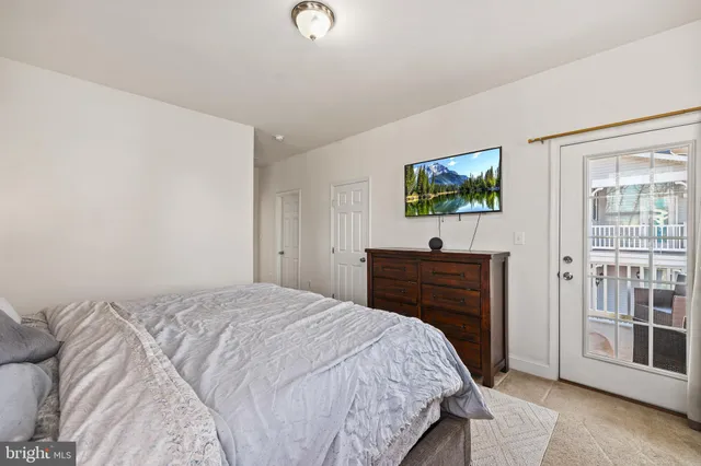 a bathroom with a double vanity sink toilet and a mirror