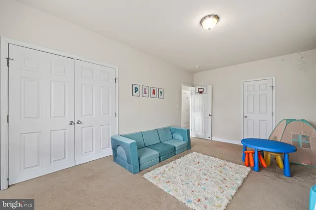 an aerial view of residential houses with yard