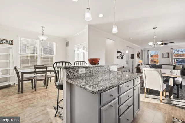 a kitchen with stainless steel appliances a refrigerator sink and cabinets