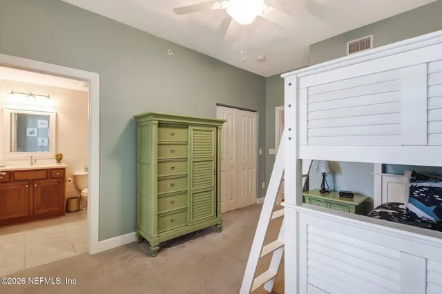 a bedroom with a bed and a couch