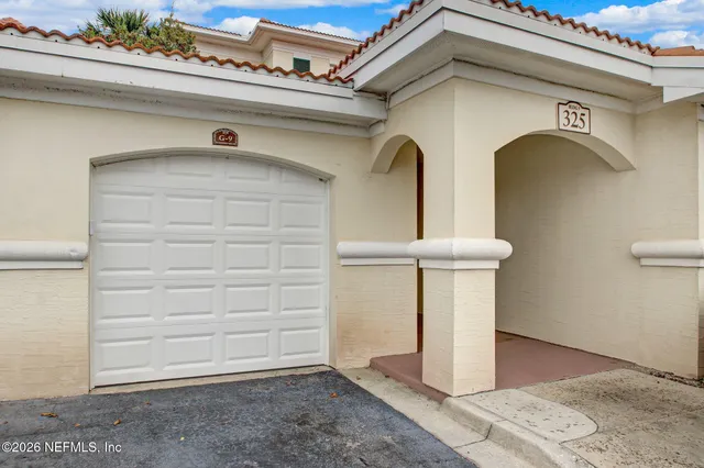 a view of a lake with a house in the background