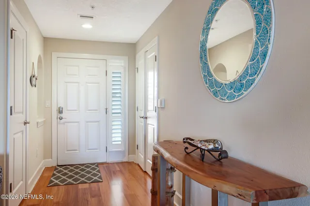 a bedroom with a bed and a mirror