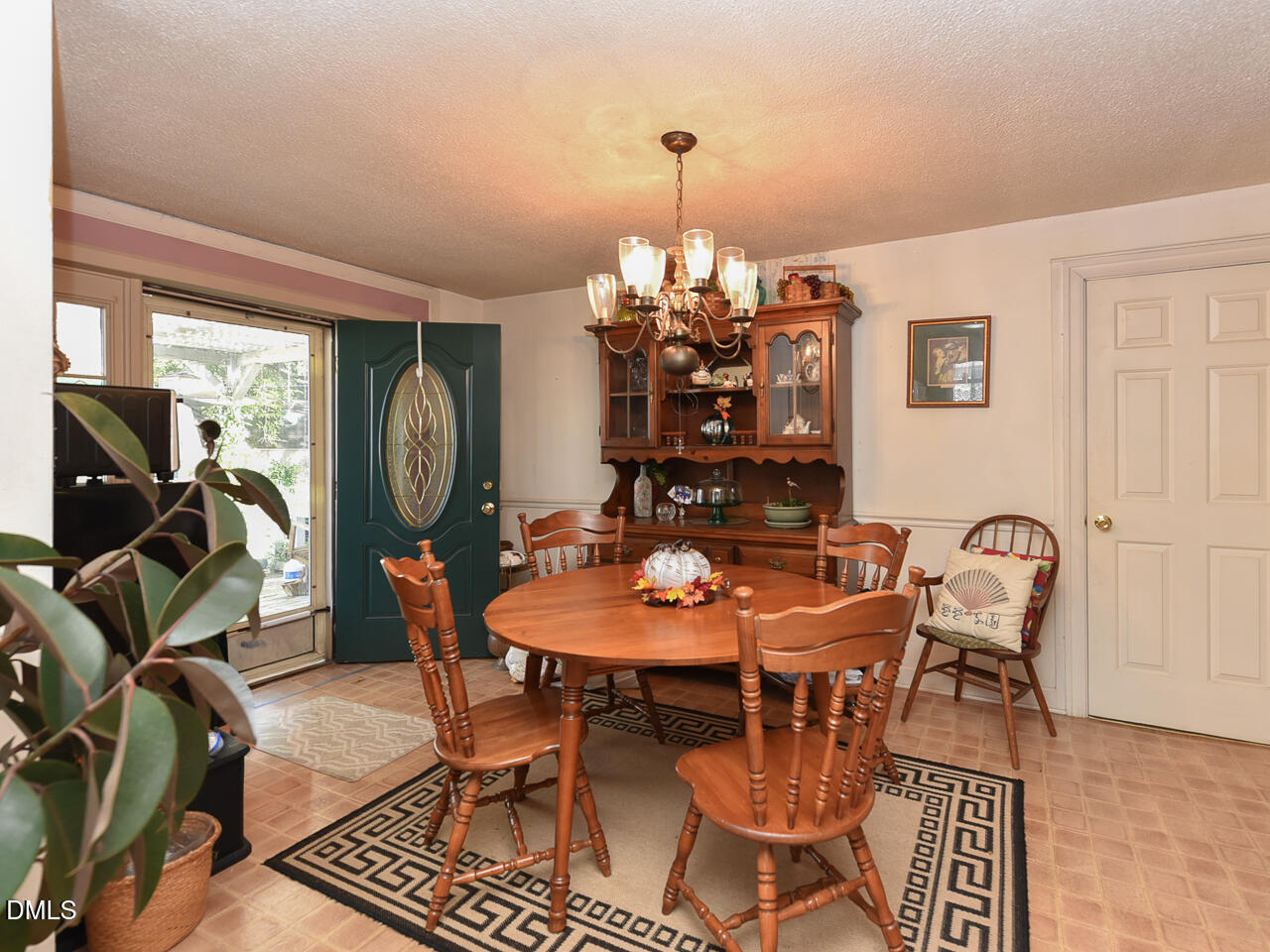 314 West Main Street Benson, NC 27504 - Photo 11 of 30 a view of a dining room with furniture and chandelier