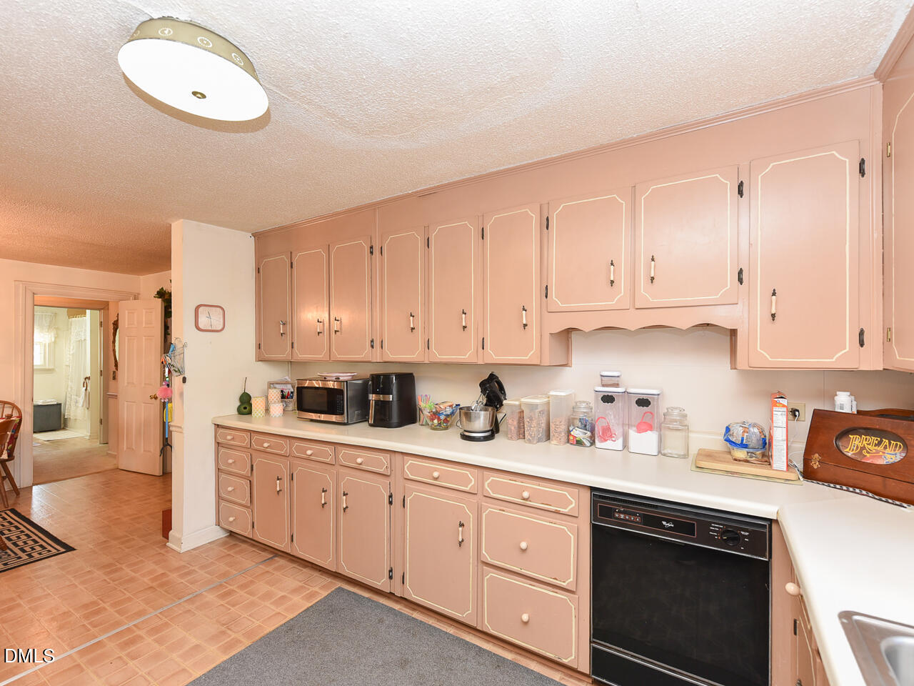 314 West Main Street Benson, NC 27504 - Photo 13 of 30 a kitchen with cabinets stainless steel appliances and a sink