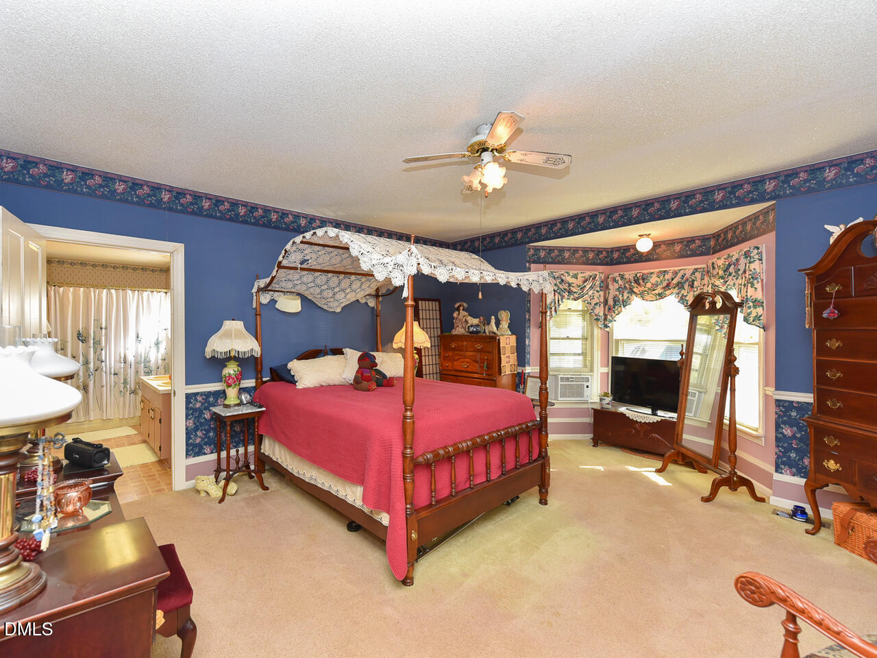 314 West Main Street Benson, NC 27504 - Photo 19 of 30 a bedroom with a bed and wooden floor