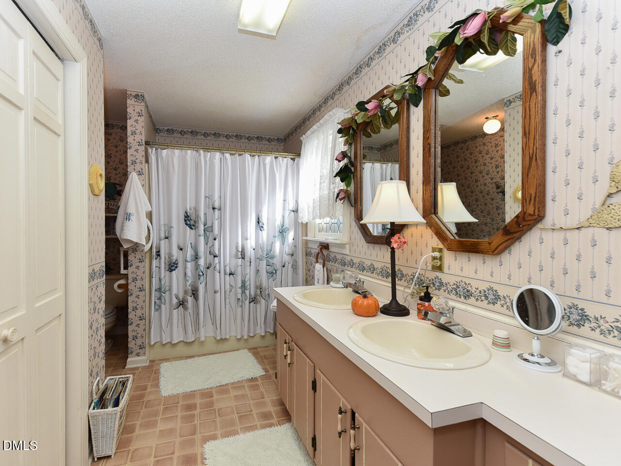 314 West Main Street Benson, NC 27504 - Photo 20 of 30 a bathroom with a double vanity sink mirror and shower