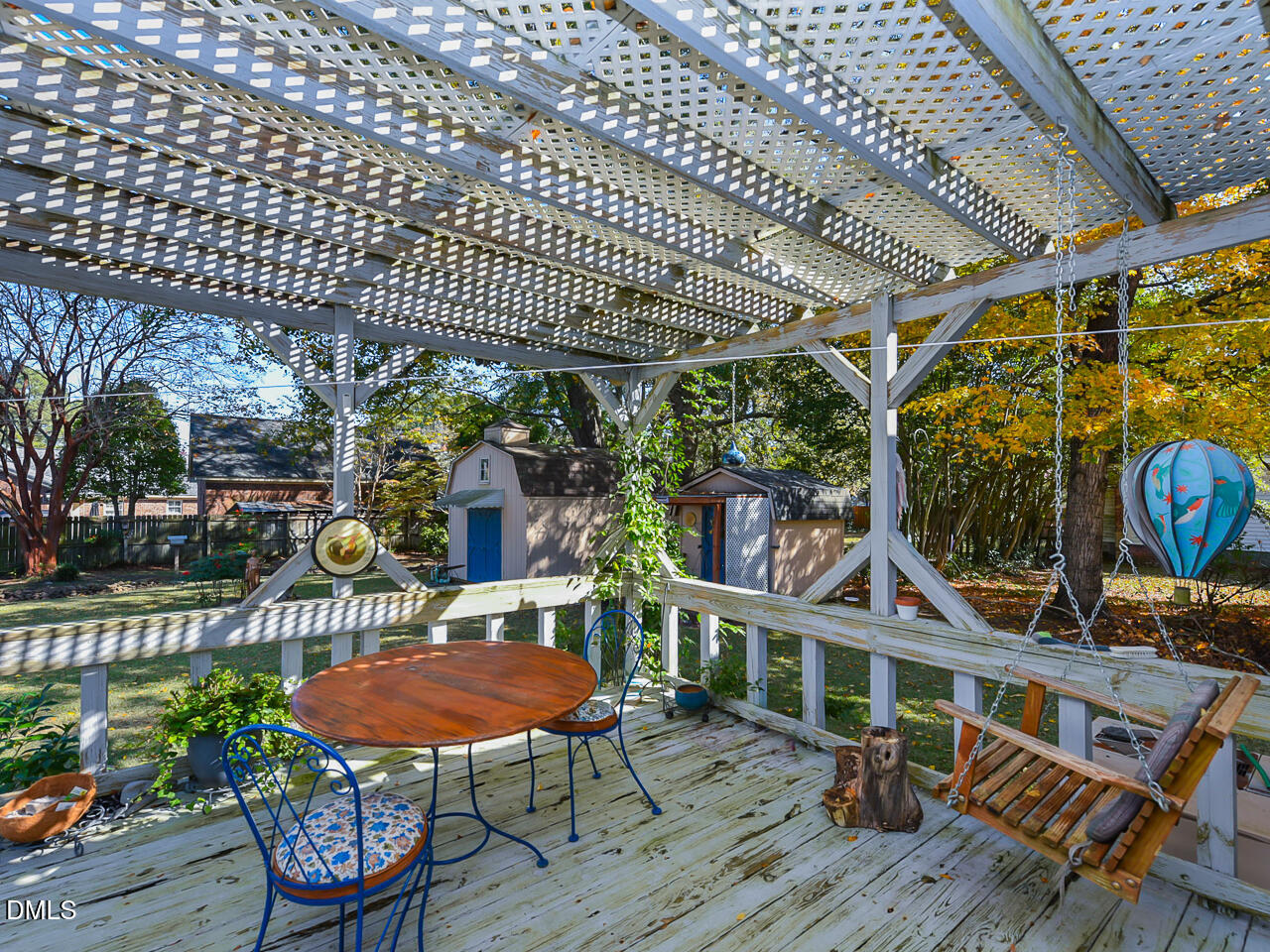 314 West Main Street Benson, NC 27504 - Photo 26 of 30 a view of a chairs and table in the patio and a garden