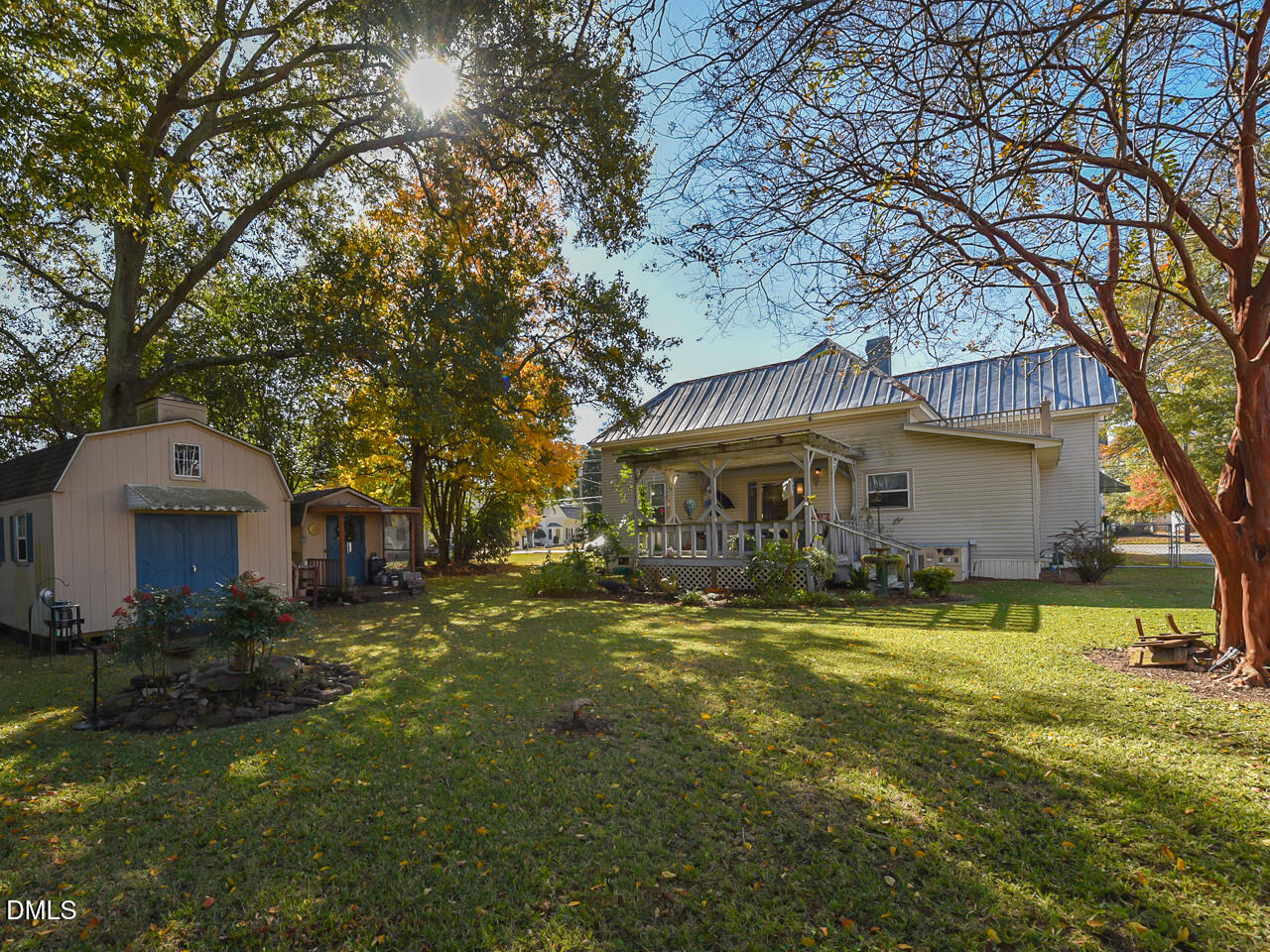 314 West Main Street Benson, NC 27504 - Photo 27 of 30 a view of a house with a yard and sitting area