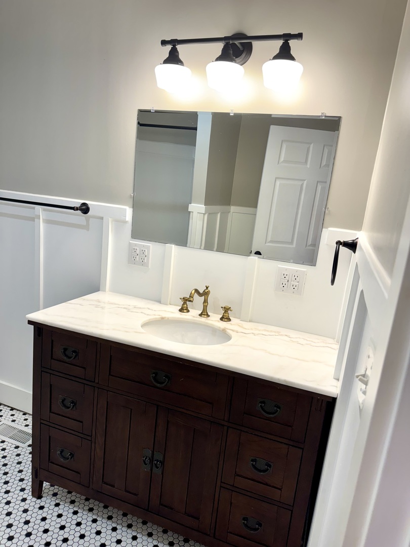 56 May Avenue Buncombe, IL 62912 - Photo 16 of 25 a bathroom with a sink and a mirror