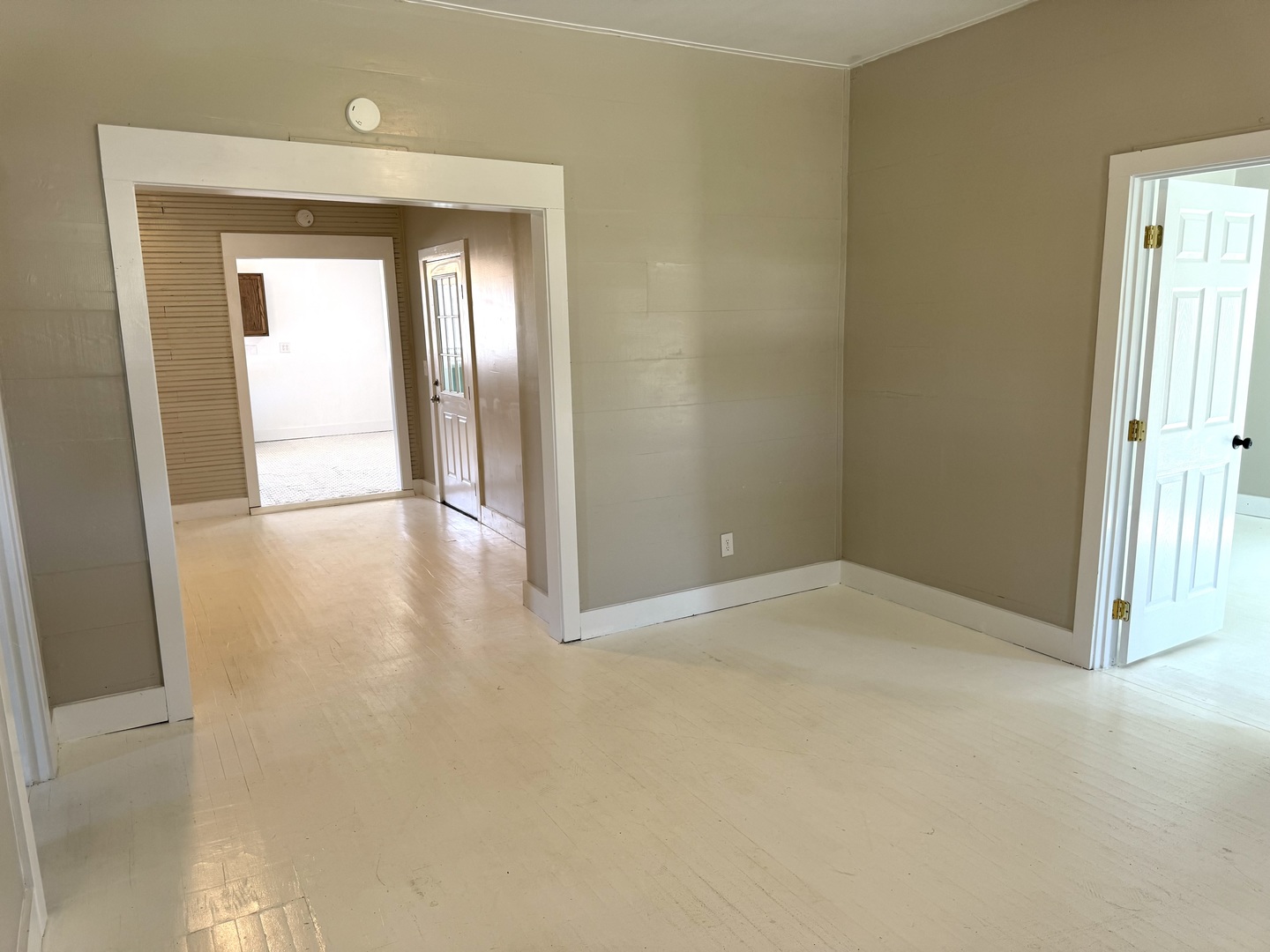 56 May Avenue Buncombe, IL 62912 - Photo 19 of 25 a view of an empty room with wooden floor and a window