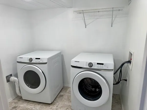 a utility room with dryer and washer