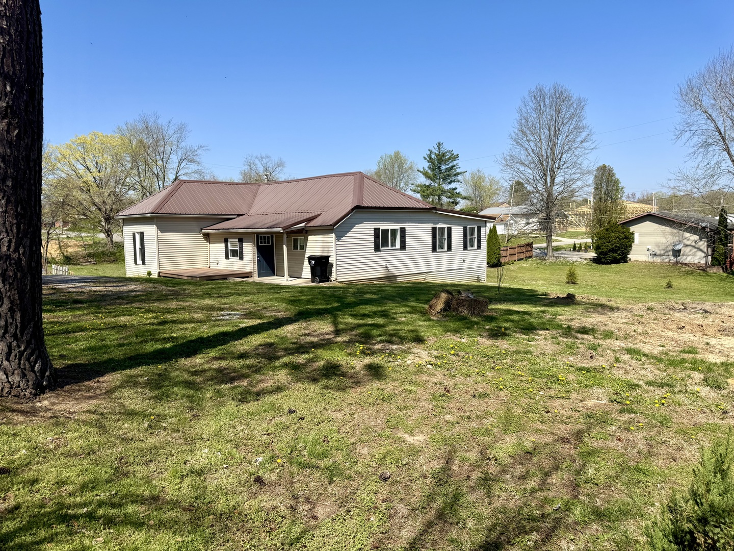 56 May Avenue Buncombe, IL 62912 - Photo 6 of 25 a front view of a house with a garden