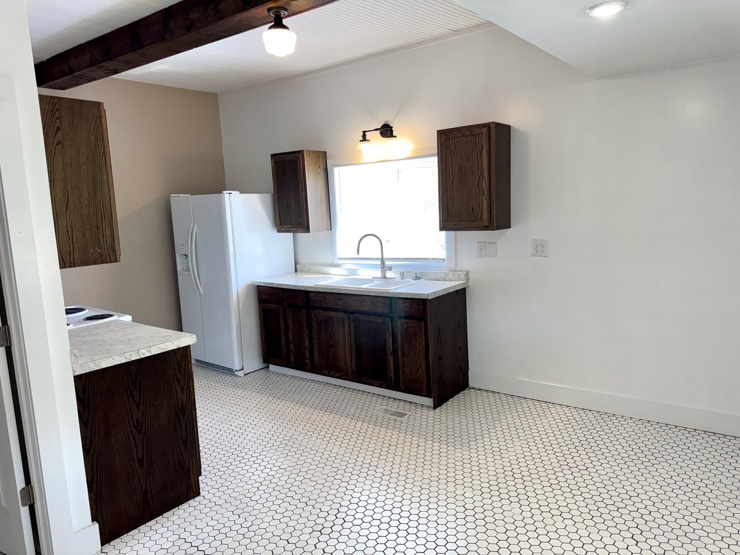 56 May Avenue Buncombe, IL 62912 - Photo 10 of 25 a bathroom with a granite countertop sink and a mirror