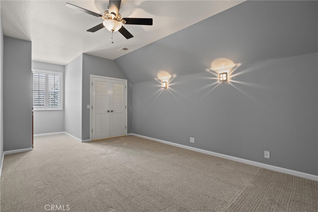 6310 County Road 18 Orland, CA 95963 - Photo 32 of 72 an empty room with closet and a chandelier fan