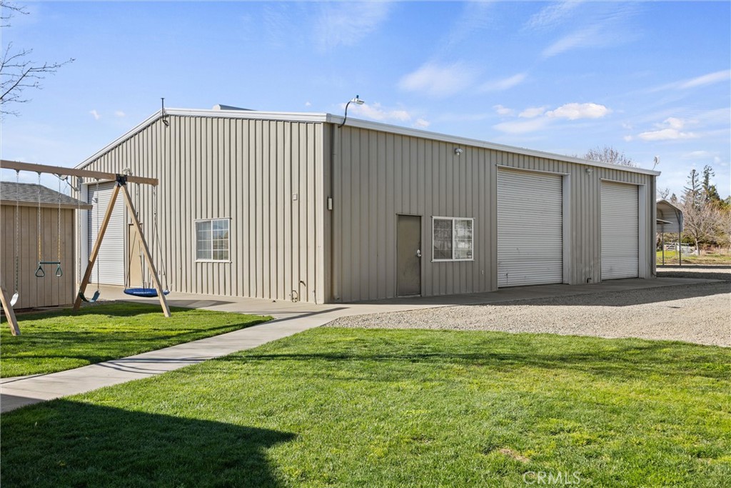 6310 County Road 18 Orland, CA 95963 - Photo 51 of 72 a front view of a house with a yard and garage