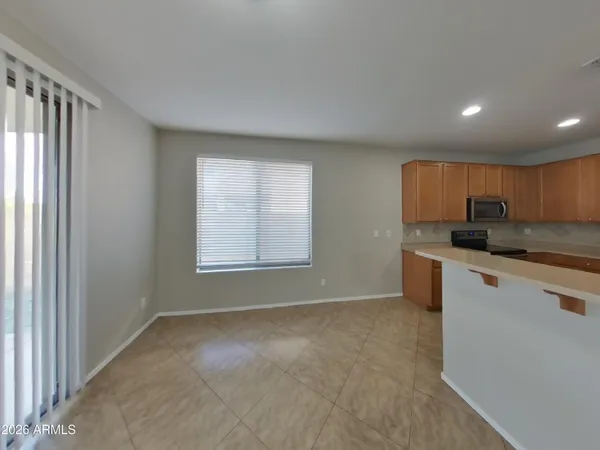 a kitchen with a refrigerator and a sink