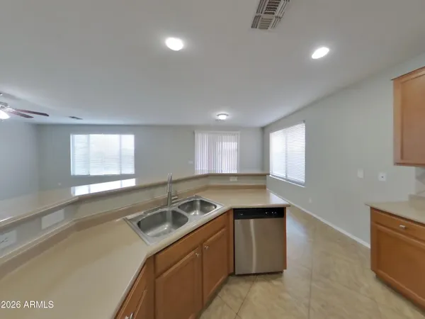 a kitchen that has a sink a stove and window
