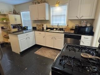 932 Walling Street Houston, TX 77009 - Photo 2 of 23 a kitchen with a stove a sink and cabinets