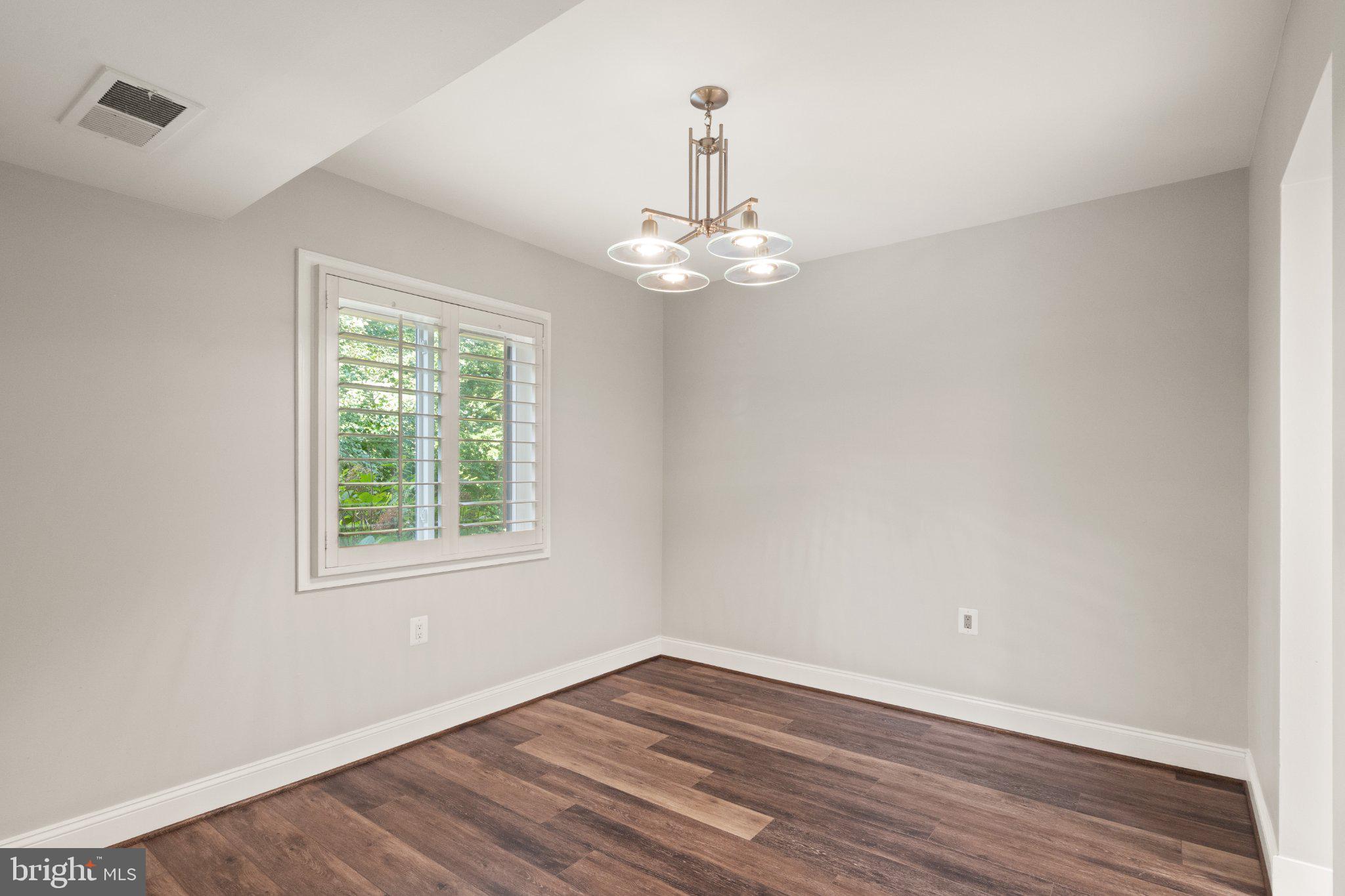 1414 Northgate Square, Unit 14/1B Reston, VA 20190 - Photo 16 of 49 Dining room custom shutters and LVP flooring