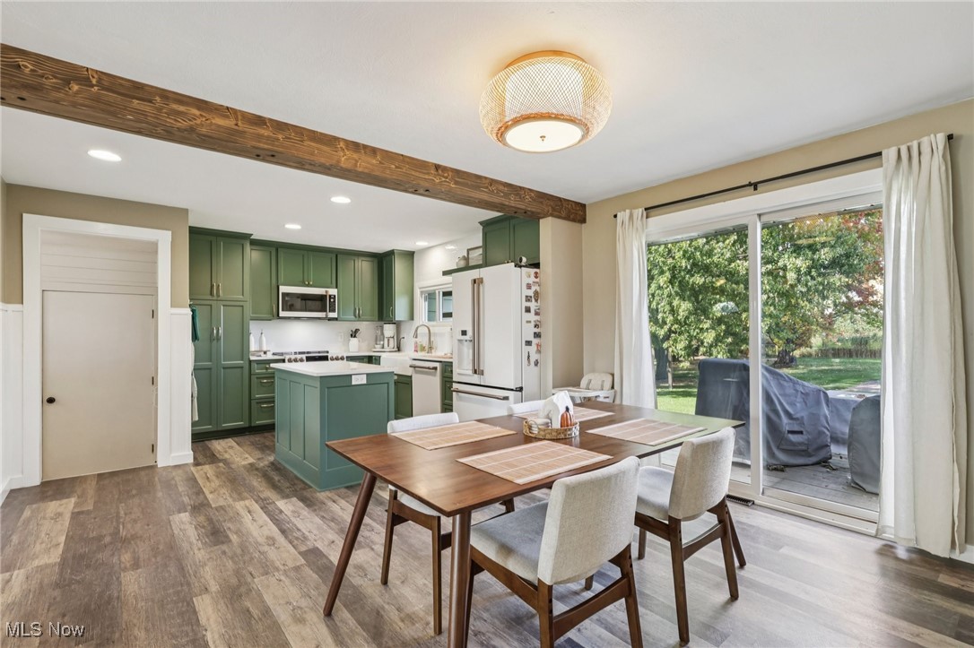 6147 Stone Road Medina, OH 44256 - Photo 11 of 40 Dining space featuring beam ceiling, dark wood-type flooring, and recessed lighting