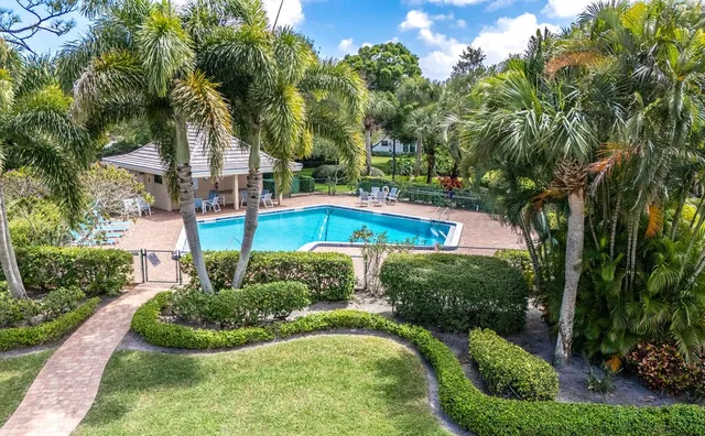 a view of a swimming pool with a garden