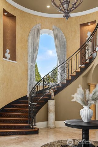 a kitchen with stainless steel appliances granite countertop a stove and a refrigerator