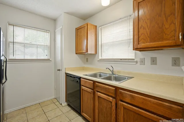 a view of a sink and a window