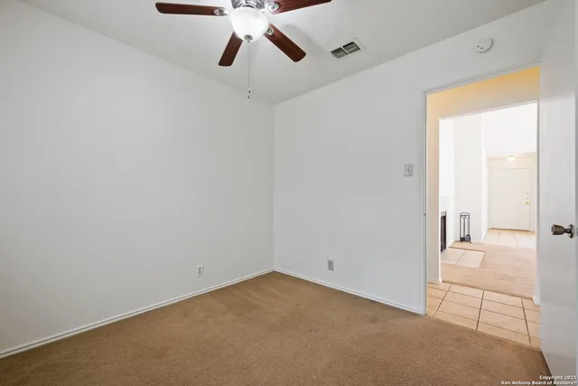 a view of a room that has a window in it