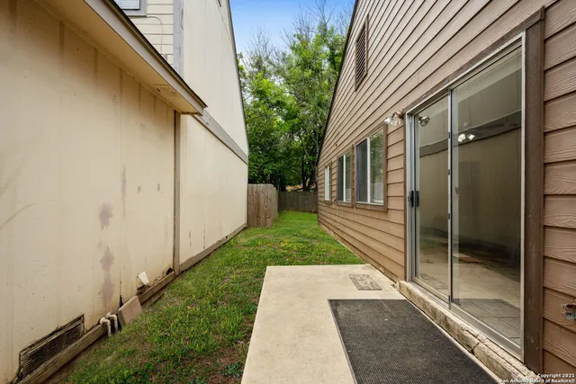 a view of a back yard of the house