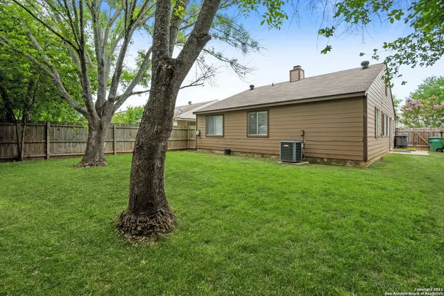 a front view of house with a garden