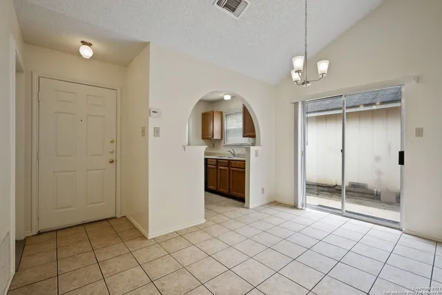 a view of a kitchen with a sink and a refrigerator window