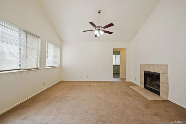 a view of empty room with fireplace