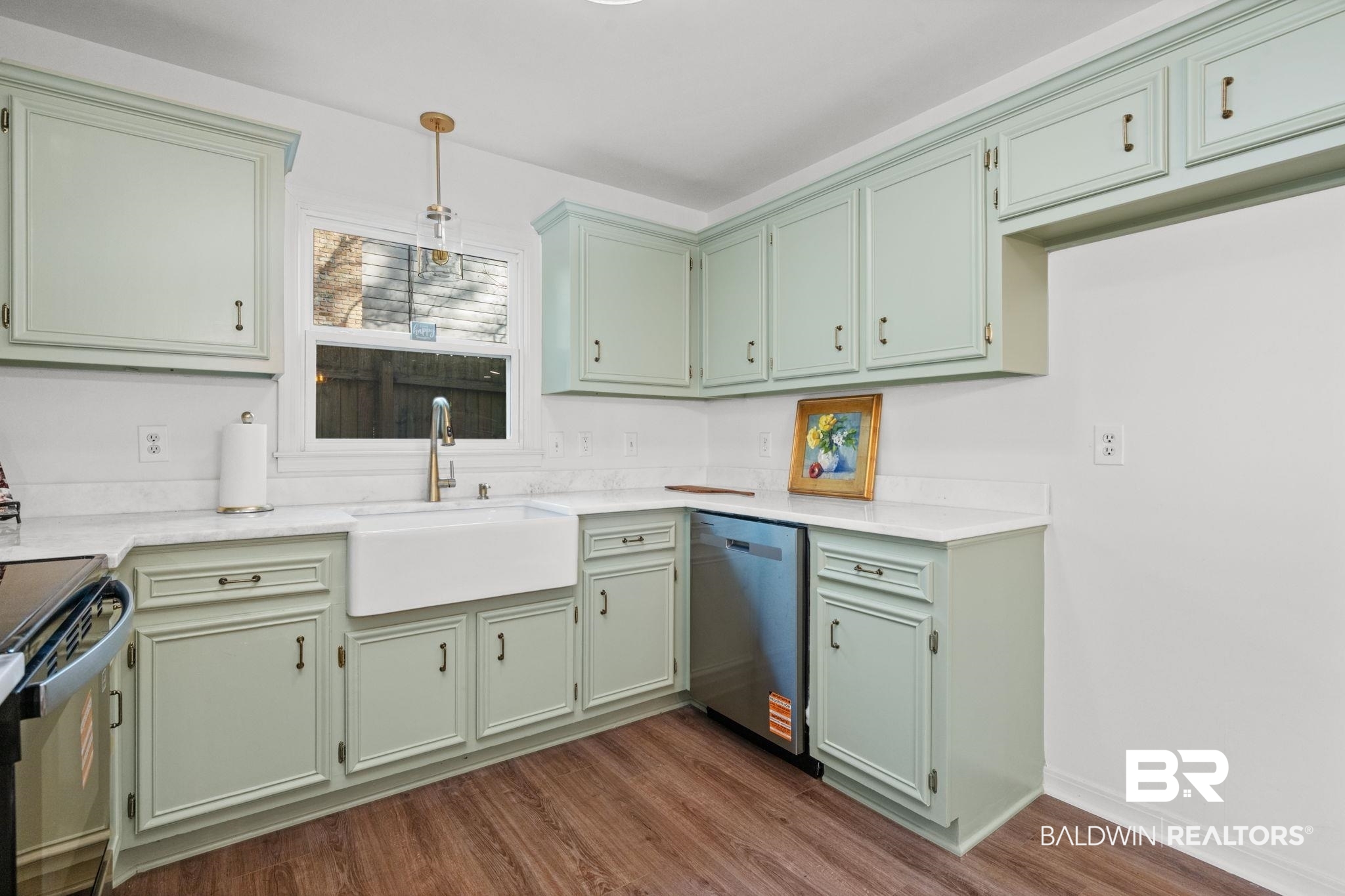 511 Wacker Lane North Mobile, AL 36608 - Photo 22 of 45 Kitchen with green cabinets, stainless steel dishwasher, pendant lighting, dark wood finished floors, and light stone counters