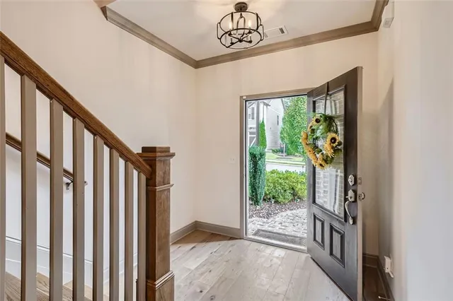 a view of an entryway with wooden floor