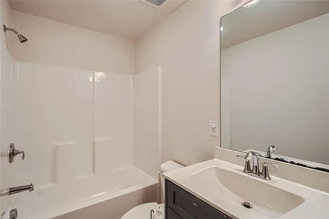 a bathroom with a sink and a bathtub