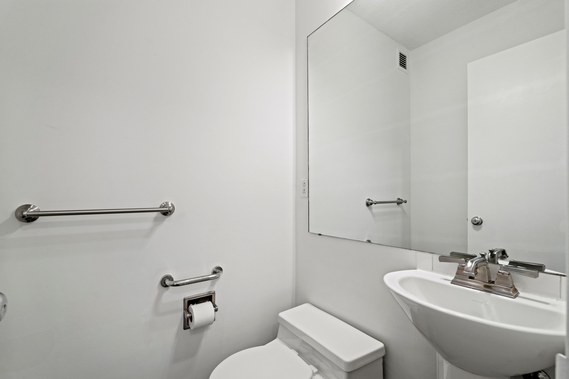 50 East 89th Street, Unit 3C Manhattan, NY 10128 - Photo 10 of 16 a bathroom with a sink mirror and toilet