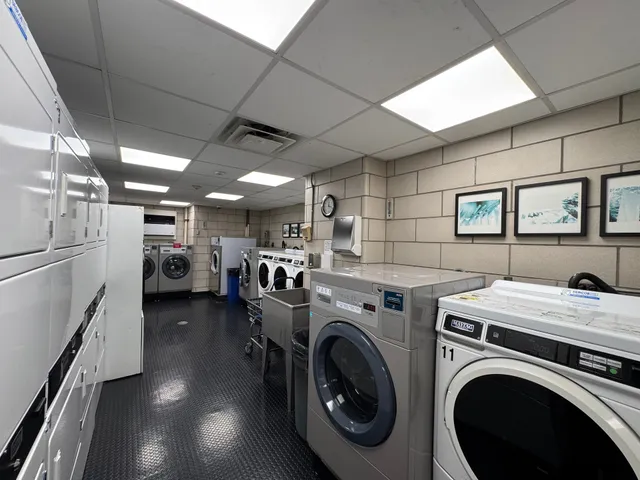 a view of storage and utility room with washer and dryer