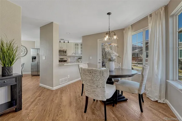 a dining room with furniture window wooden floor