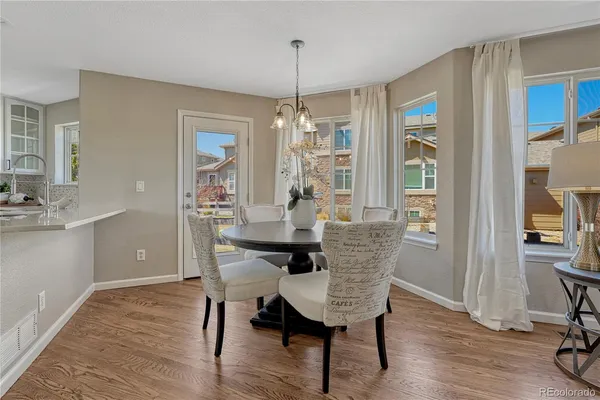 a dining room with furniture window wooden floor